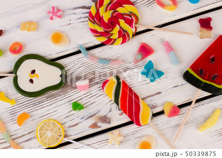 Colored candies, sweets and lollipops. Colored candies, sweets and lollipops. 50339875