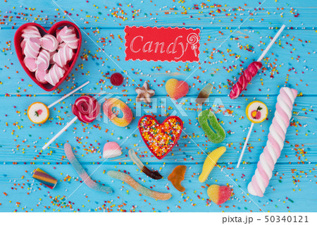 Sweet background with lollipops, candies and marshmallows. Sweet background with lollipops, candies and marshmallows. 50340121