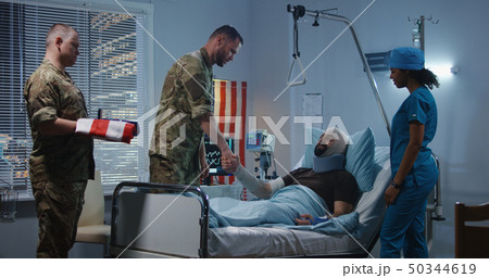 Injured soldier receives badge of honor in hospital 50344619