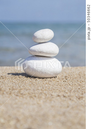 stack of pebble stones on balance on sandy beach stack of pebble stones on balance on sandy beach 50346662