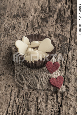 heart shaped chocolates on wooden table heart shaped chocolates on wooden table 50348663
