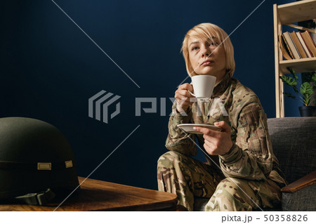 Portrait of young female soldier 50358826