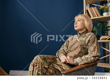 Portrait of young female soldier 50358841