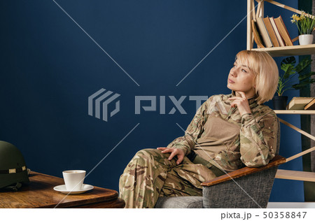 Portrait of young female soldier 50358847