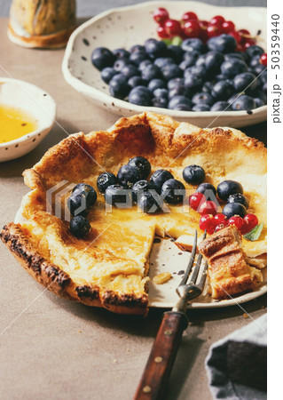 Dutch baby with berries 50359440