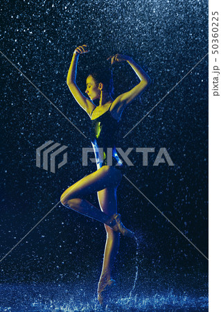 Two young female ballet dancers under water drops Two young female ballet dancers under water drops 50360225