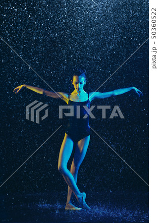 Two young female ballet dancers under water drops 50360522