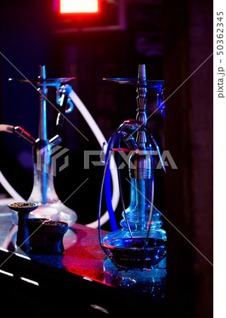 Group of eastern hookahs on table of a bar. 50362345