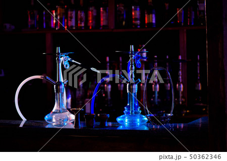 Group of eastern hookahs on table of a bar. Group of eastern hookahs on table of a bar. 50362346