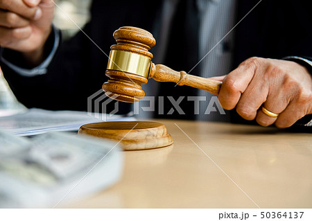 Lawyer businessman in suit hides money. Lawyer businessman in suit hides money. 50364137