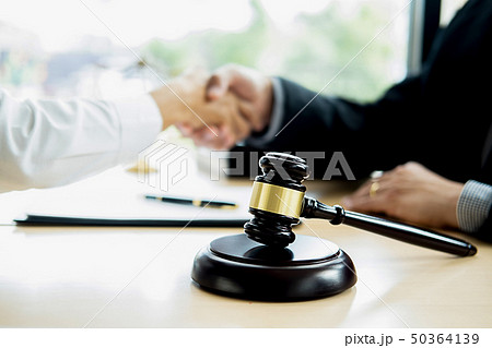 Judge gavel with Justice lawyer having team 50364139