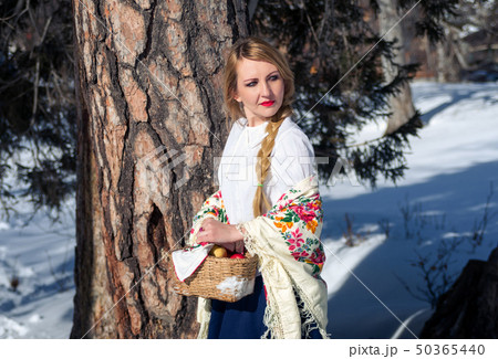 Woman portrait in the snow. Russian style Woman portrait in the snow. Russian style 50365440