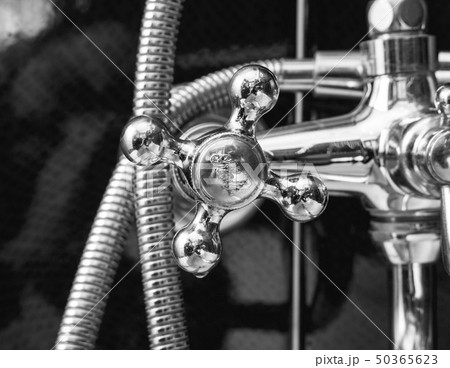 Tap closeup in modern bathroom Tap closeup in modern bathroom 50365623
