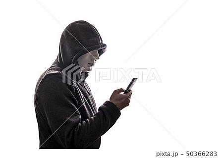 Hooded hacker with mask holding smartphone 50366283