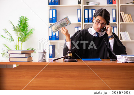 Young handsome judge working in court Young handsome judge working in court 50367608