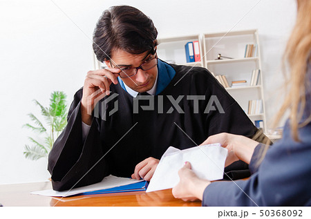 Young woman visiting male lawyer  50368092
