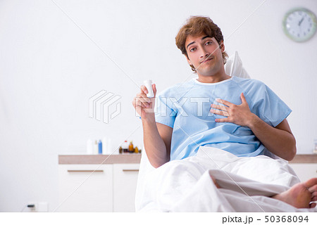 Young male patient lying on couch in hospital  50368094