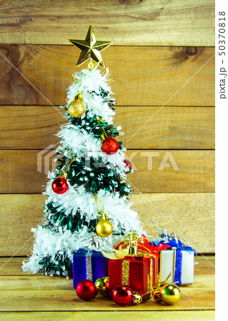 Christmas tree with many presents under it  50370818
