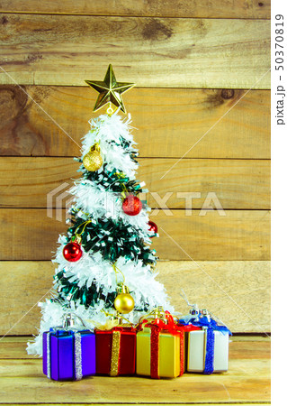 Christmas tree with many presents under it  50370819