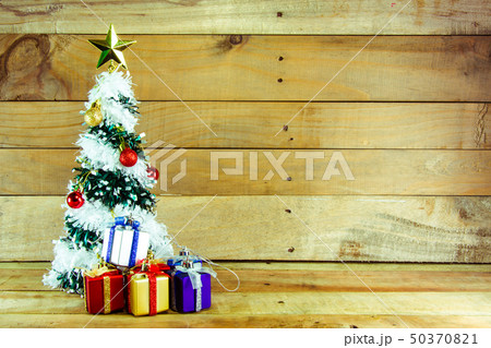 Christmas tree with many presents under it  50370821