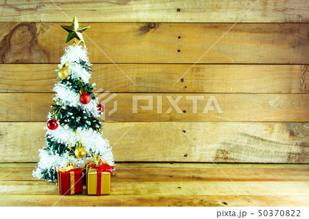 Christmas tree with many presents under it  50370822