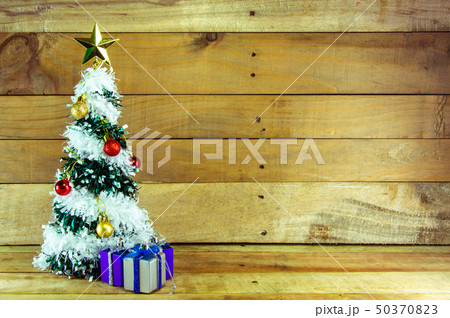 Christmas tree with many presents under it  50370823