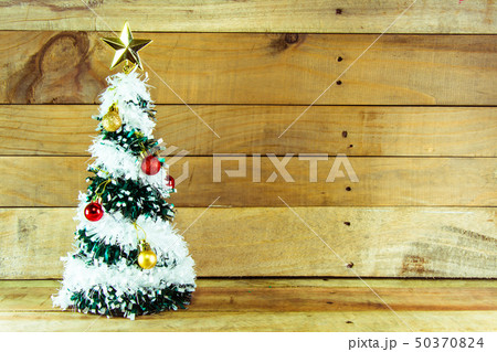 Christmas tree with many presents under it  50370824