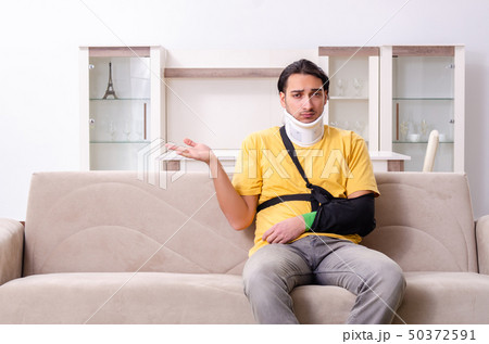 Young man after car accident suffering at home  50372591