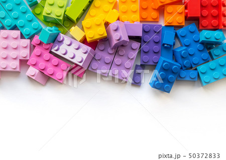 A lot of Colorful Plastick constructor blocks on white background. Popular toys. Copyspace 50372833