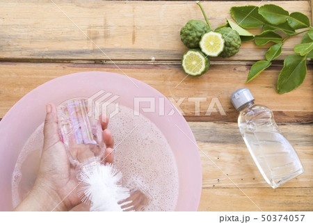 hand of woman cleaning milks bottle of baby hand of woman cleaning milks bottle of baby 50374057