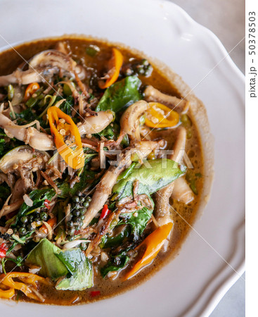 Thai spicy stir fried razor clams with herbs 50378503