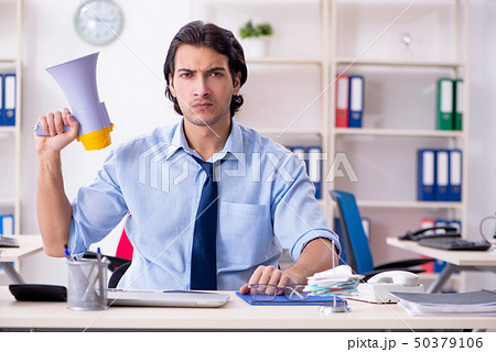 Young male businessman employee unhappy with excessive work   50379106