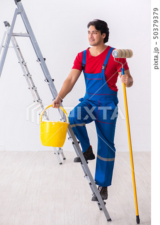 Young handsome contractor working indoors  50379379