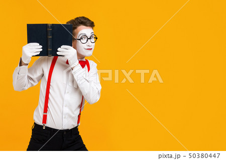 portrait of mime man artist with book 50380447