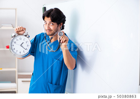 Young male doctor in front of whiteboard Young male doctor in front of whiteboard 50380863