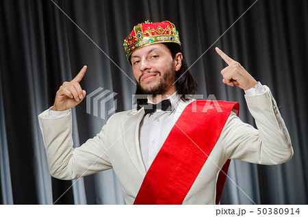 Funny king wearing crown in coronation concept 50380914