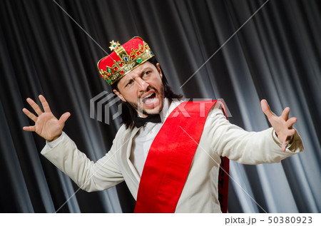 Funny king wearing crown in coronation concept 50380923