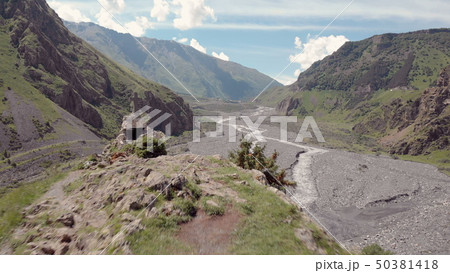 Aerial video of Dariali Gorge near Russia Georgian borders. Road goes through Caucasian mountains Aerial video of Dariali Gorge near Russia Georgian borders. Road goes through Caucasian mountains 50381418