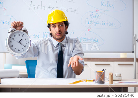 Young male architect in front of the whiteboard Young male architect in front of the whiteboard 50381440