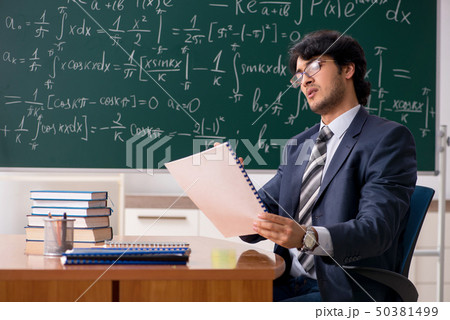 Young male math teacher in classroom の写真素材 [50381499] - PIXTA