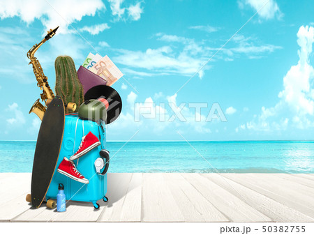 Collage of luggage for travel in front of ocean view 50382755