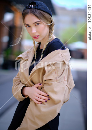 Portrait of blonde girl with flyaway hair in the 50384456