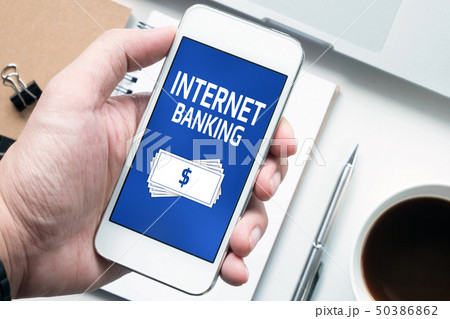 Hand holding smartphone with internet banking app 50386862