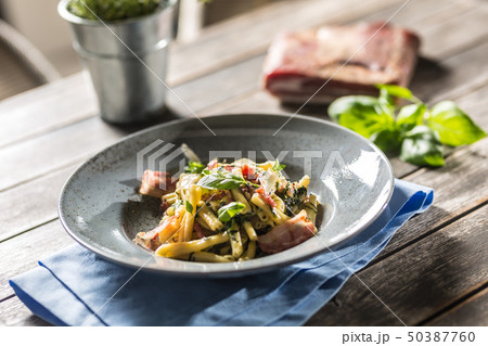 Pasta casarecce with bacon pancetta parmesan Pasta casarecce with bacon pancetta parmesan 50387760