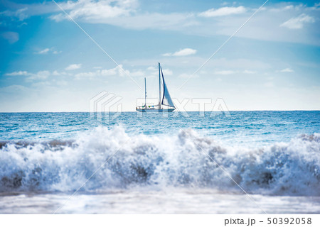 Seascape with white sailboat Seascape with white sailboat 50392058