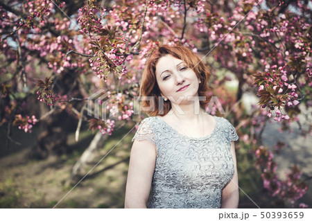 Cheerful middle aged Armenian woman, spring 50393659
