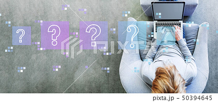 Question marks with man using a laptop Question marks with man using a laptop 50394645