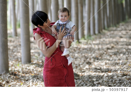 Mother and her little daughter in the forest Mother and her little daughter in the forest 50397917