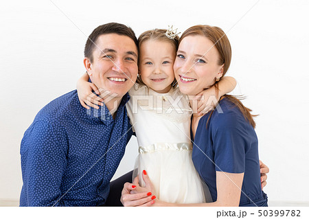 people, family and happiness concept - happy family with child on white background 50399782