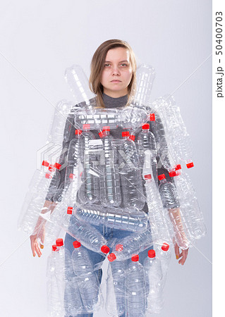 Environmental Protection, people and recyclable plastic concept - exhausted woman concerned with Environmental Protection, people and recyclable plastic concept - exhausted woman concerned with 50400703